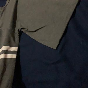 Grey cropped top with white strips on sleeves